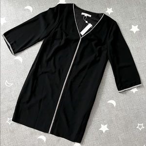 NWT black dress with long sleeves in size 8.